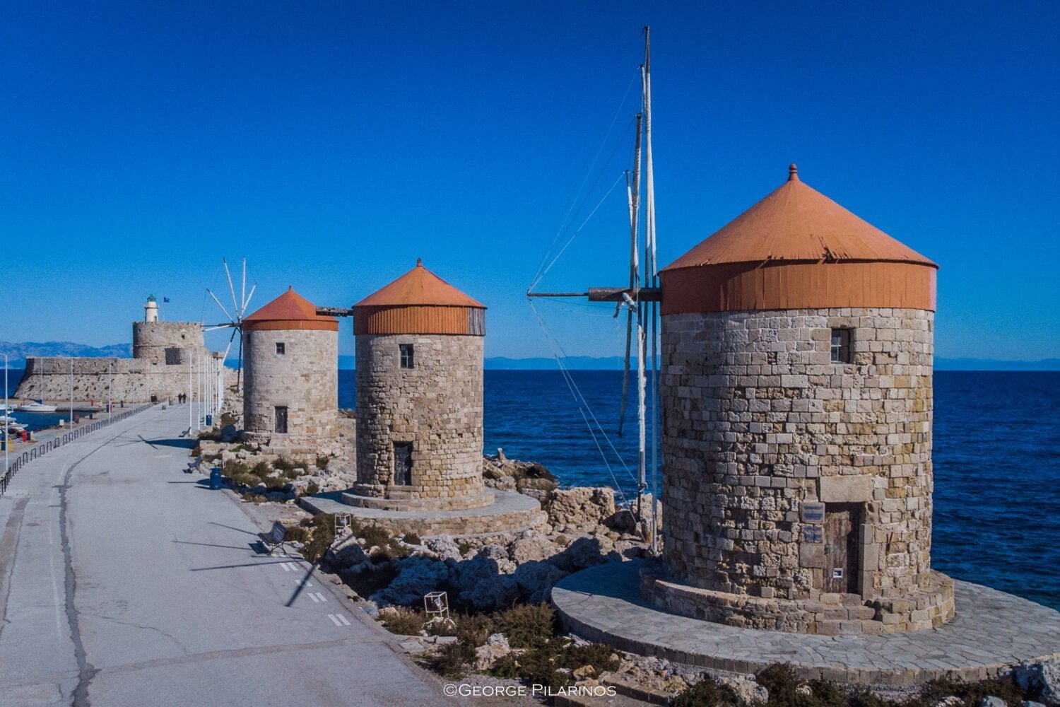 the three windmills of mandraki harbor or Rhodes